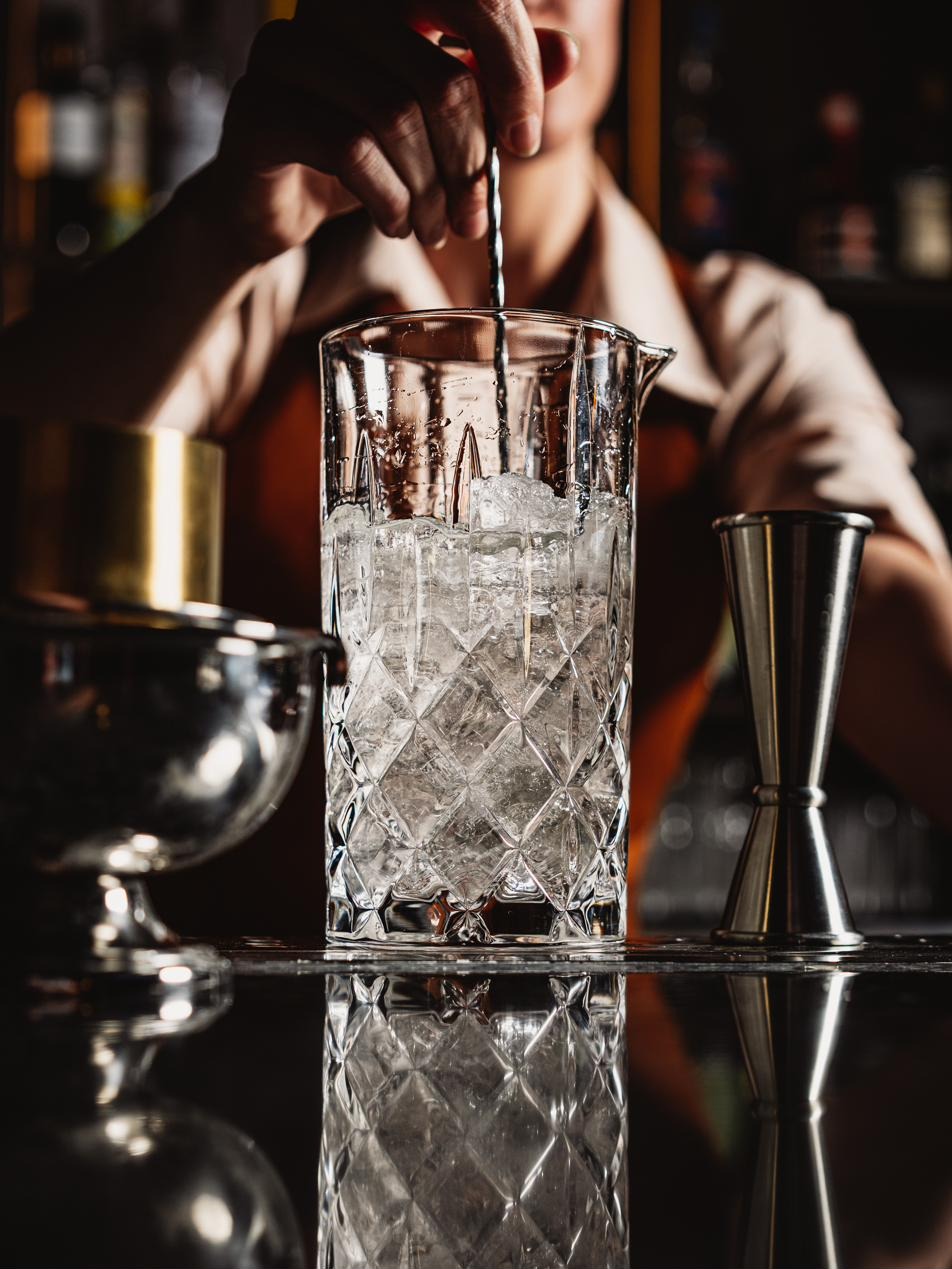 Hayworth bartender stirring cocktail with precision — Henderson Nevada restaurant bar team