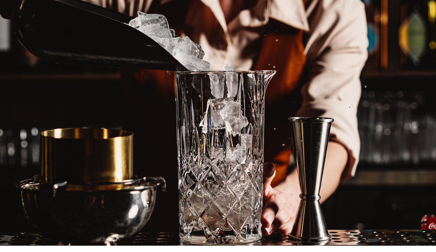 Bartender pouring ice into mixing glass at Hayworth Henderson Nevada restaurant — craft cocktail program careers
