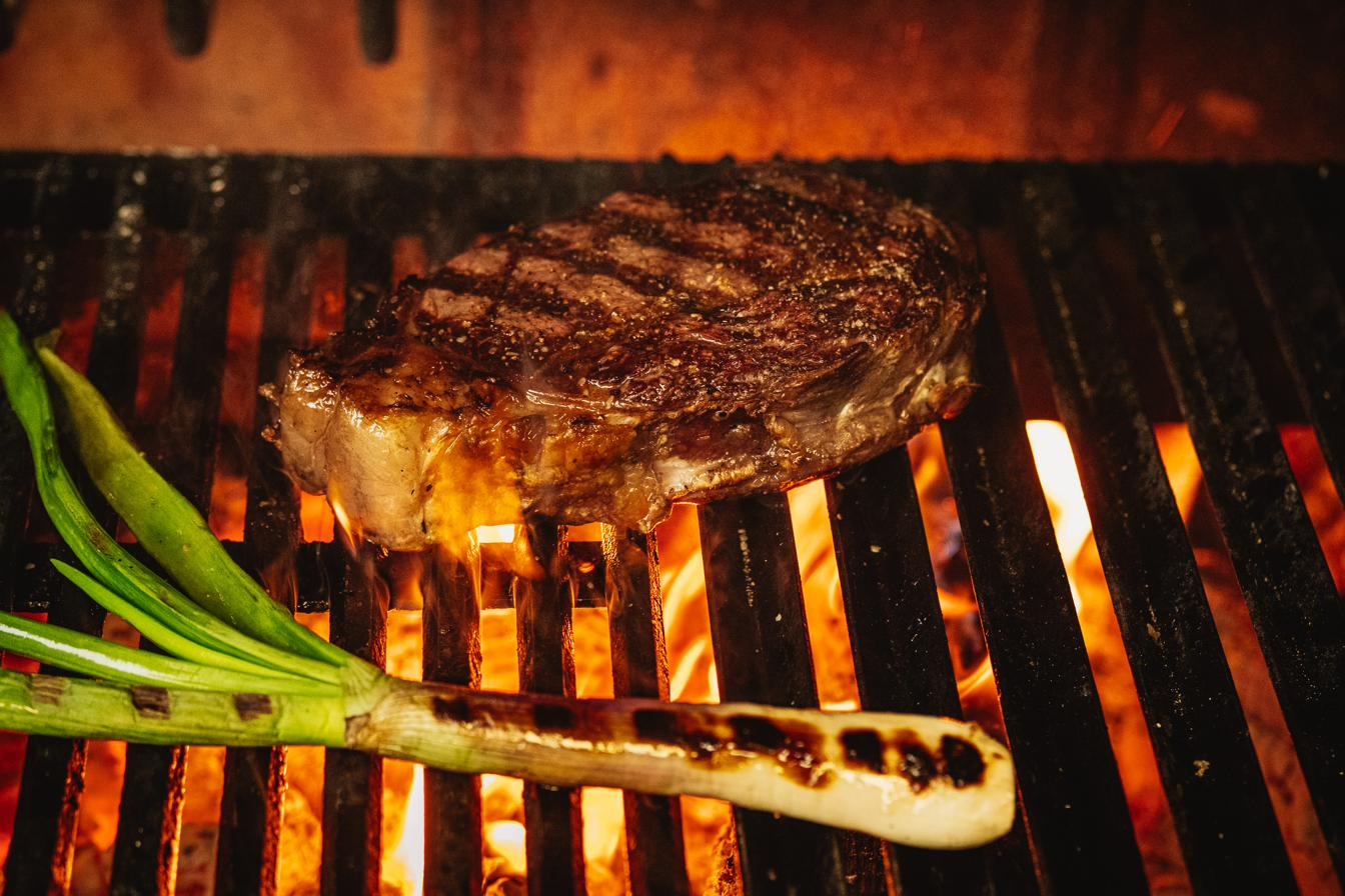 Hayworth ribeye on live post oak fire with grilled scallion — Henderson, NV
